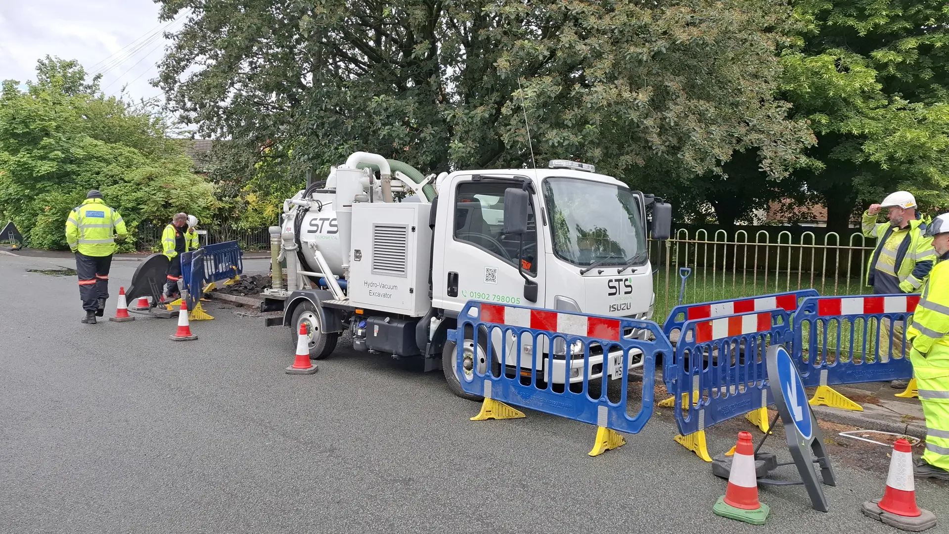Hydro-vacuum excavation equipment at a utility maintenance site